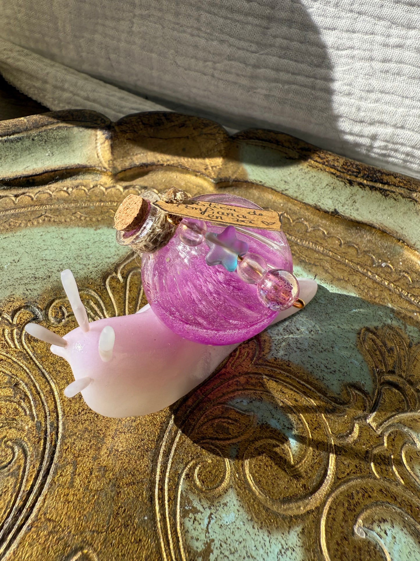 Figurine escargot potion